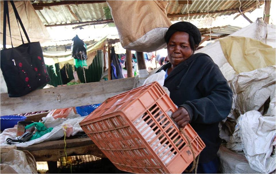 A mama mboga vegetable stall at a market