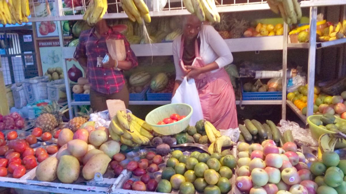 A mama mboga fruit and vegetable stall at a Kenyan market